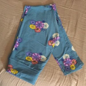Lularoe OS blue leggings with bright flowers